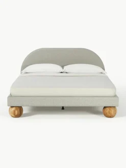 Gestoffeerd bed Rena met bolvormige poten van eikenhout^Westwing Collection New